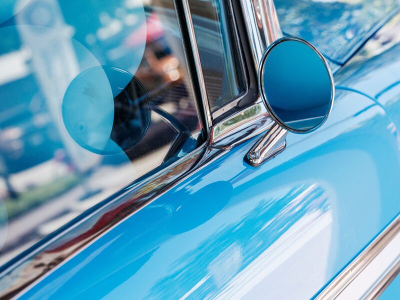 Close-up of glossy car paint reflection after professional car detailing in Rawalpindi